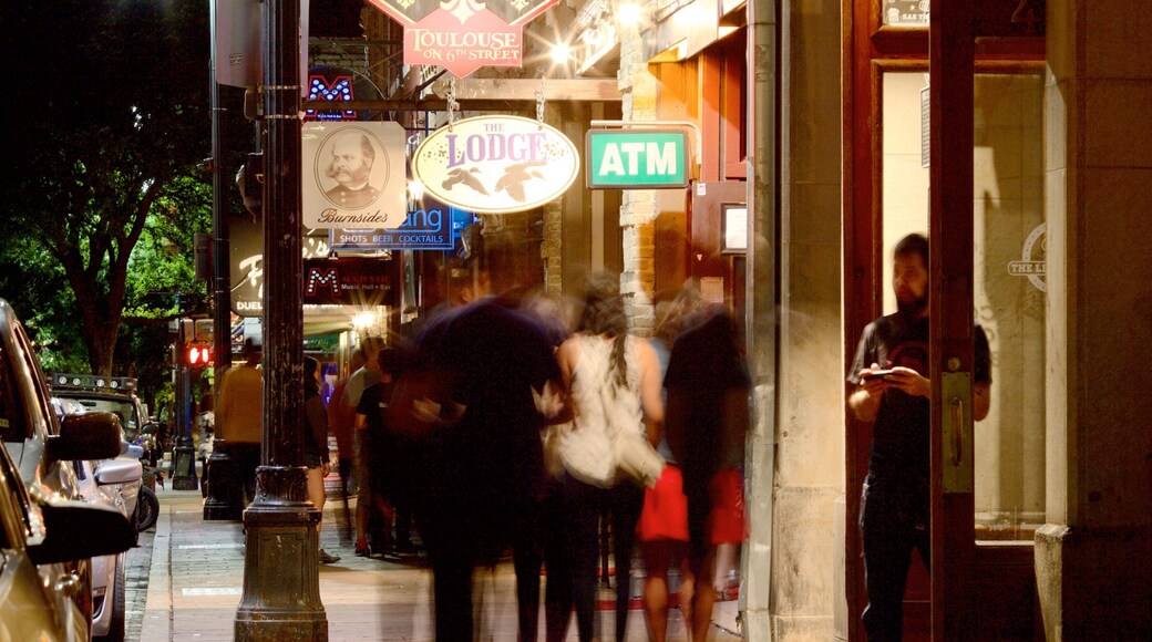 Sixth Street featuring night scenes, nightlife and a city