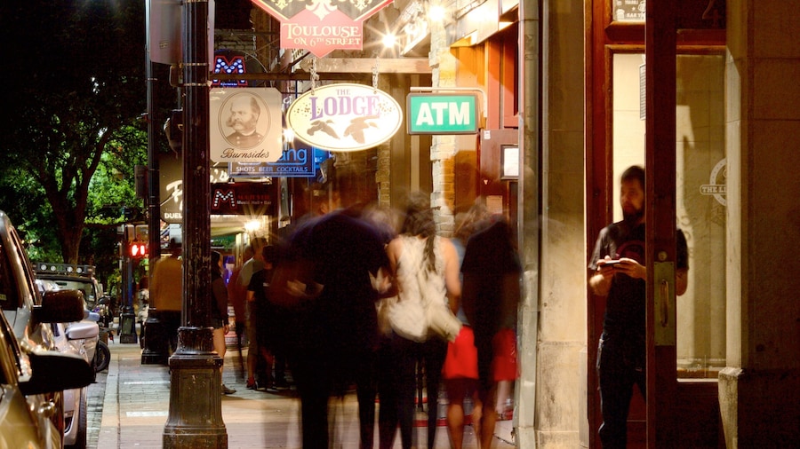 Sixth Street featuring night scenes, nightlife and a city