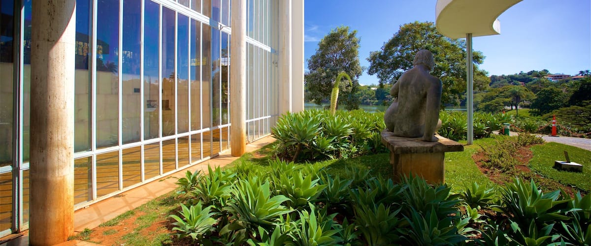 Pampulha Art Museum featuring a garden and a statue or sculpture