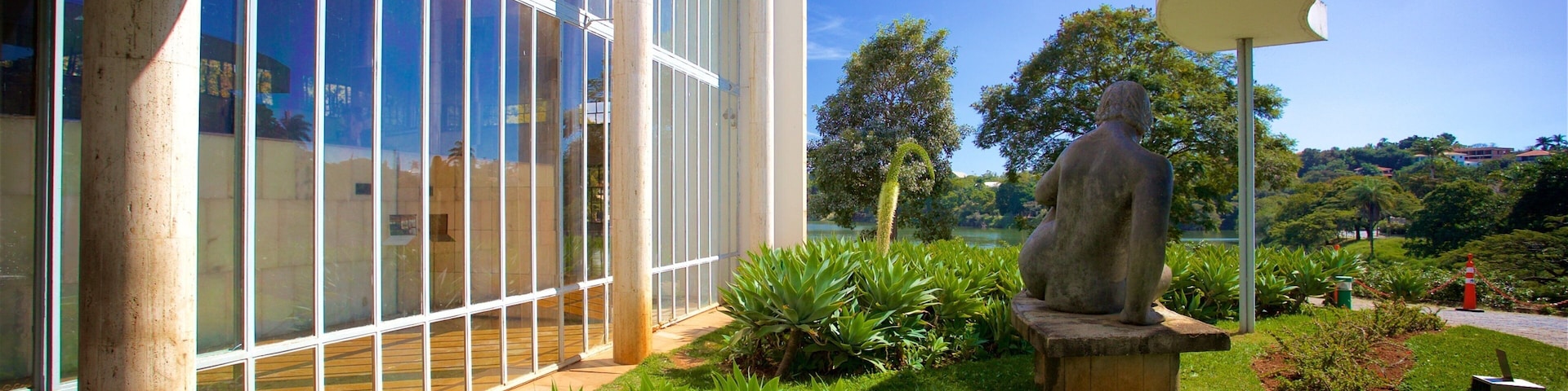 Museu de Arte da Pampulha mostrando uma estátua ou escultura e um parque