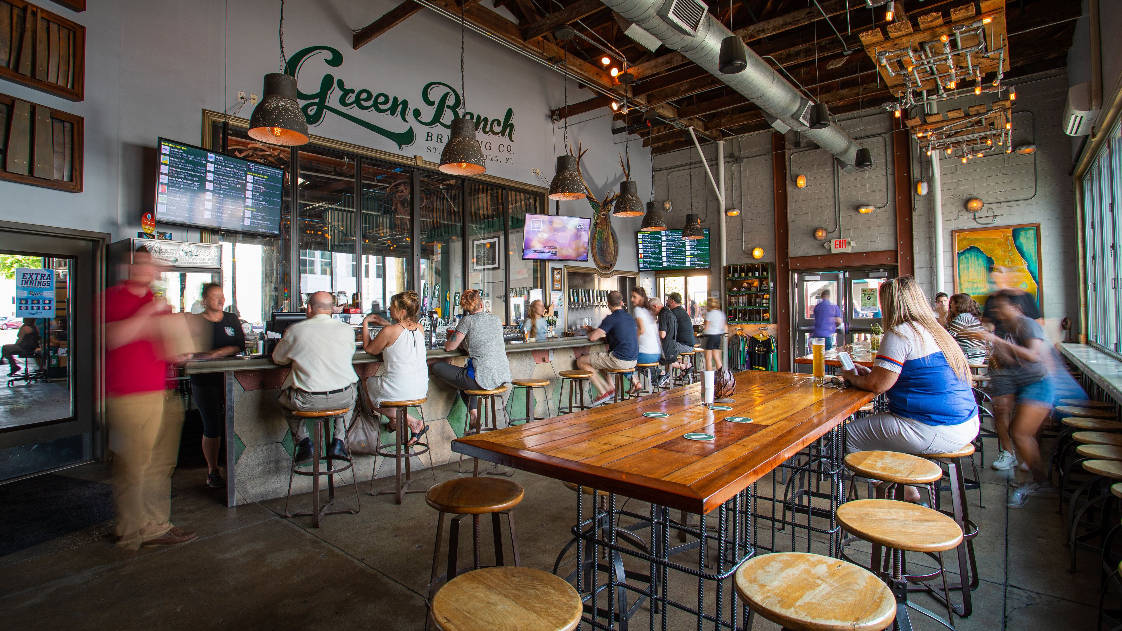 Downtown St. Petersburg featuring interior views and a bar as well as a small group of people