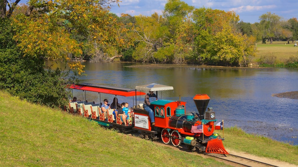 Train ride through Landa Park in New Braunfels offers scenic views and family fun on a sunny day