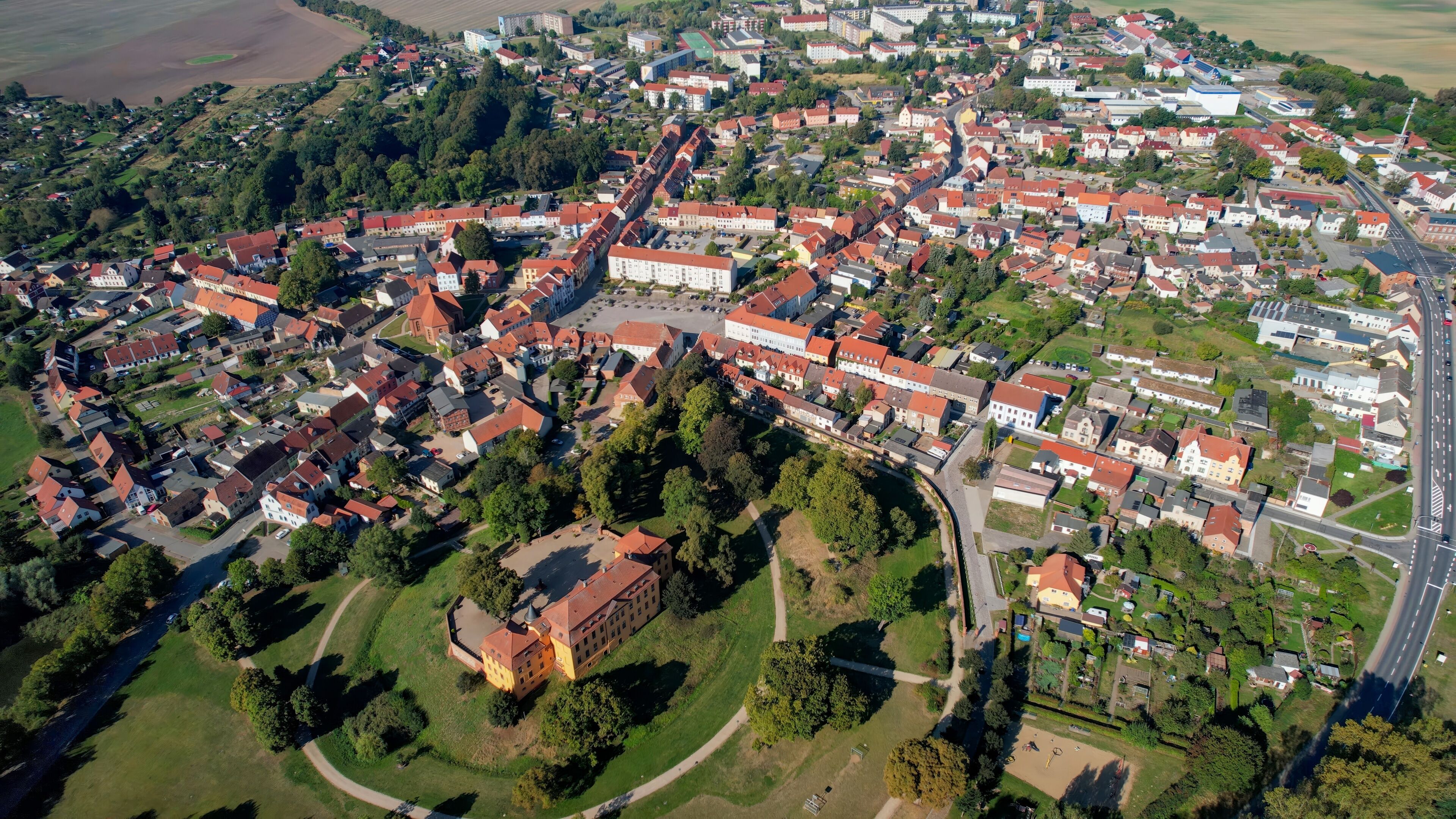 Aerial panoramic view around the old town of the city Stavenhagen on a sunny noon in summer in Germany.