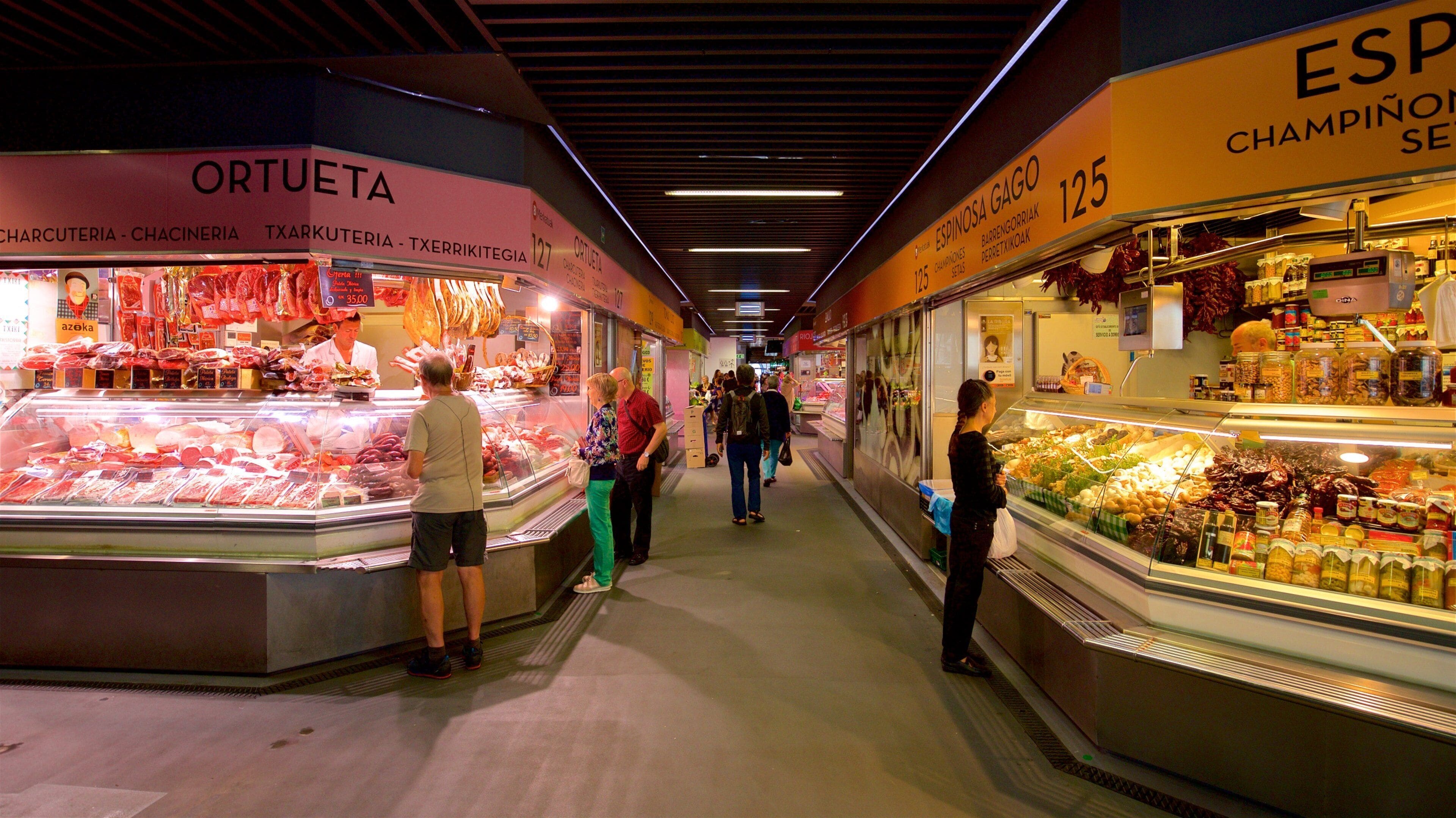 Ribera Market which includes markets, food and interior views