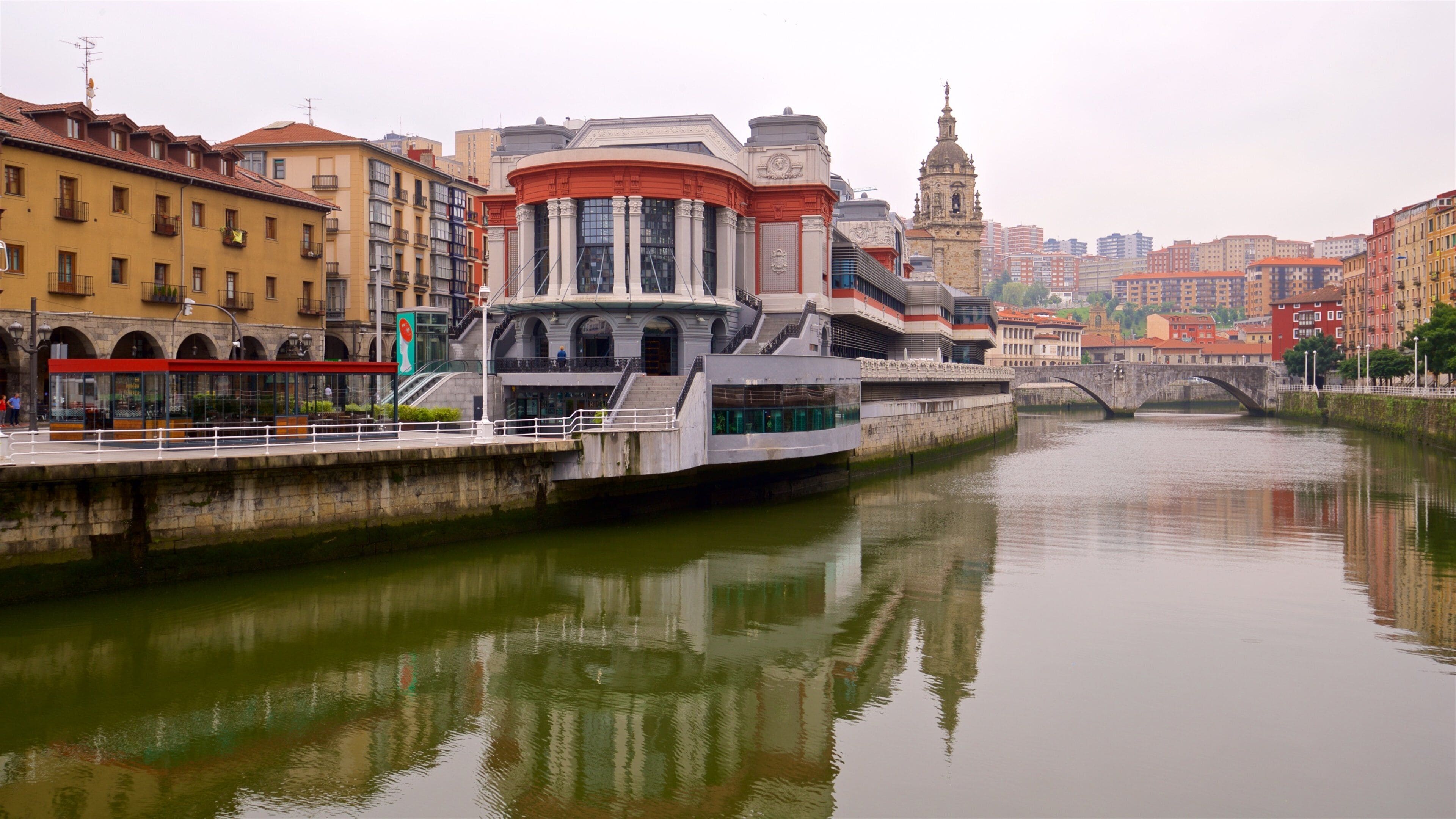 Ribera Market featuring a river or creek, a bridge and a city