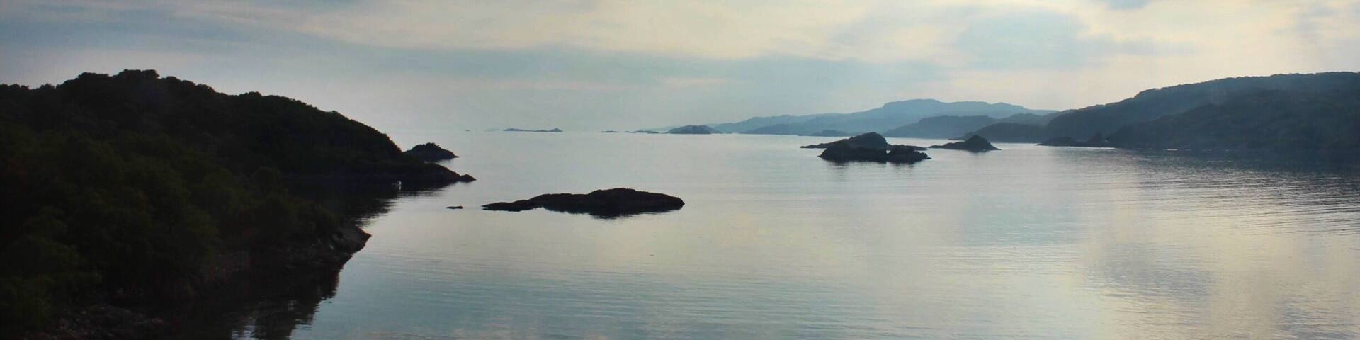 One of the most magical aspects of Scotland is how quickly the land will change from one hour to the next. How it can go from land and loch, to the sky pouring down and filling the lowlands with its glory. Travel from Fort William to Mallaig, then go back again and see how the land transforms. #scotland #highlands #unitedkingdom #landscape