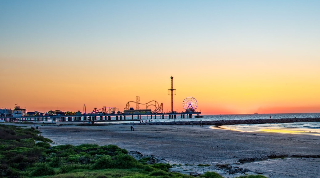Sunrise on Galveston beach with pier