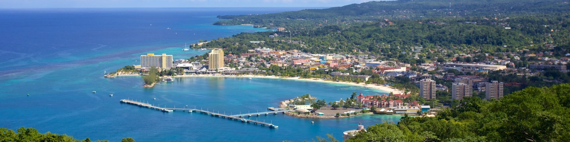 Mystic Mountain which includes a bay or harbor and a coastal town
