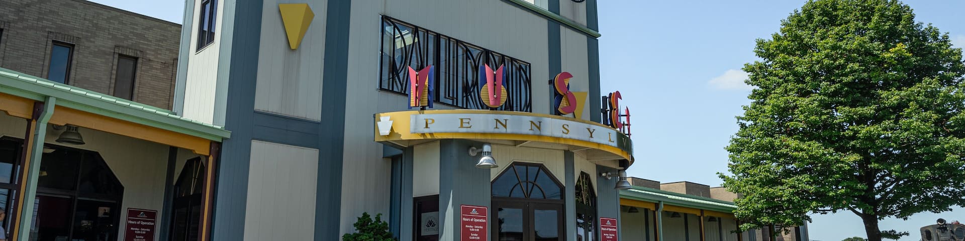 A building with a clock tower and a sign reading "PENNSYLVANIA".