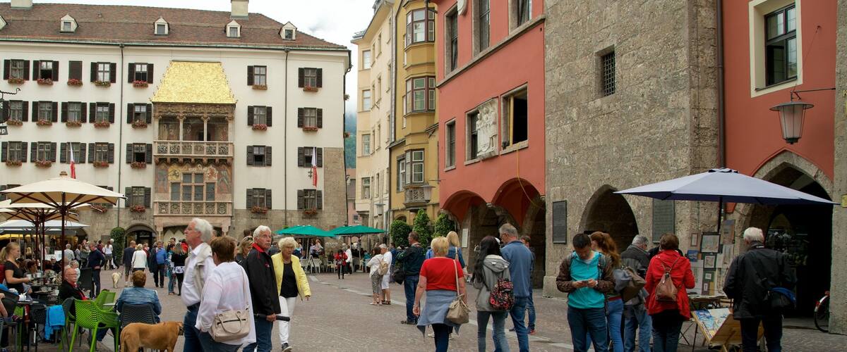 Old Town which includes a square or plaza and heritage elements as well as a large group of people