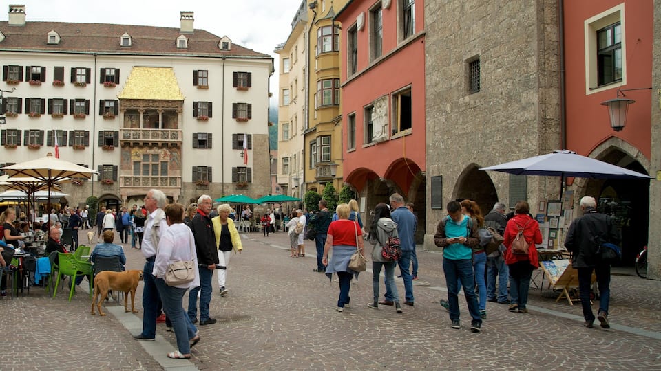 Old Town featuring heritage elements and a square or plaza as well as a large group of people
