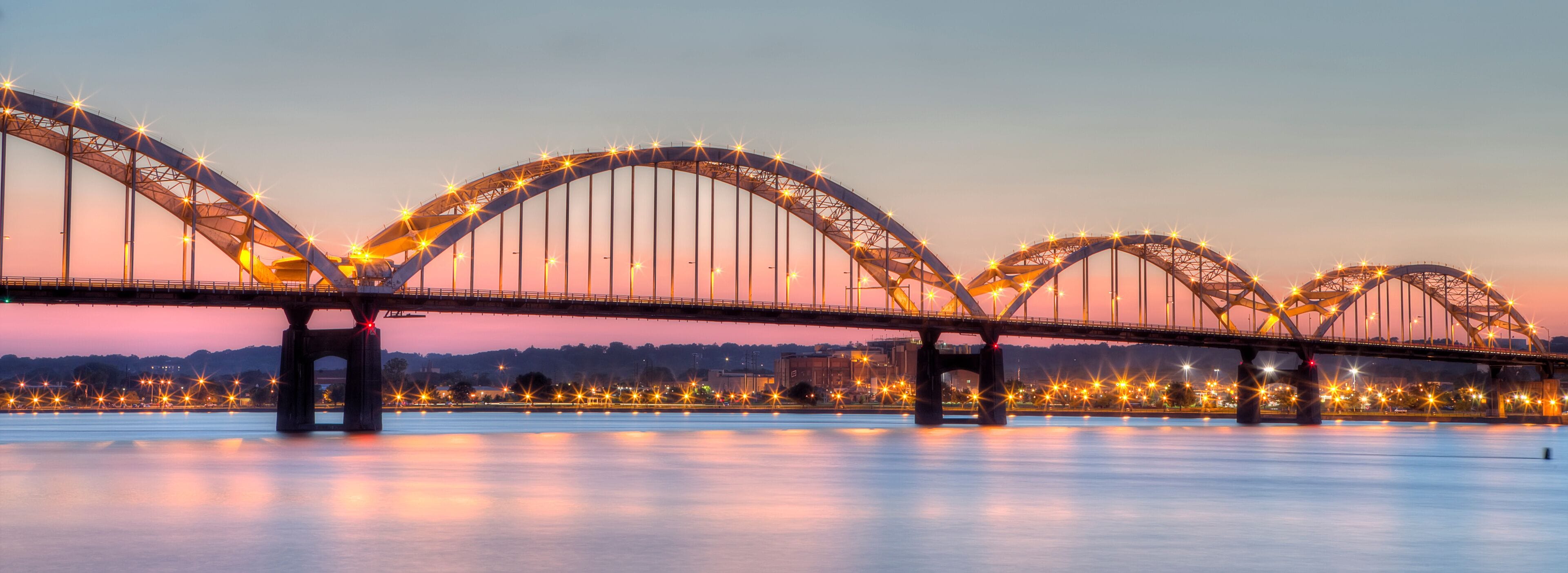 Centennial Bridge across the Mississippi River at dusk between Rock Island, Illinois and Davenport, Iowa