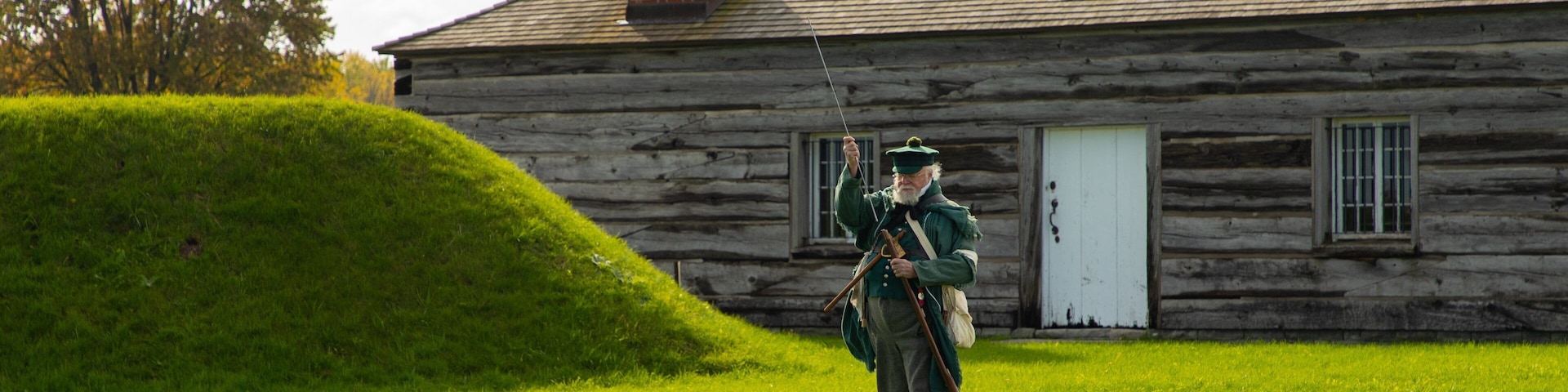 Fort George National Historic Site showing a small town or village and heritage elements as well as an individual male