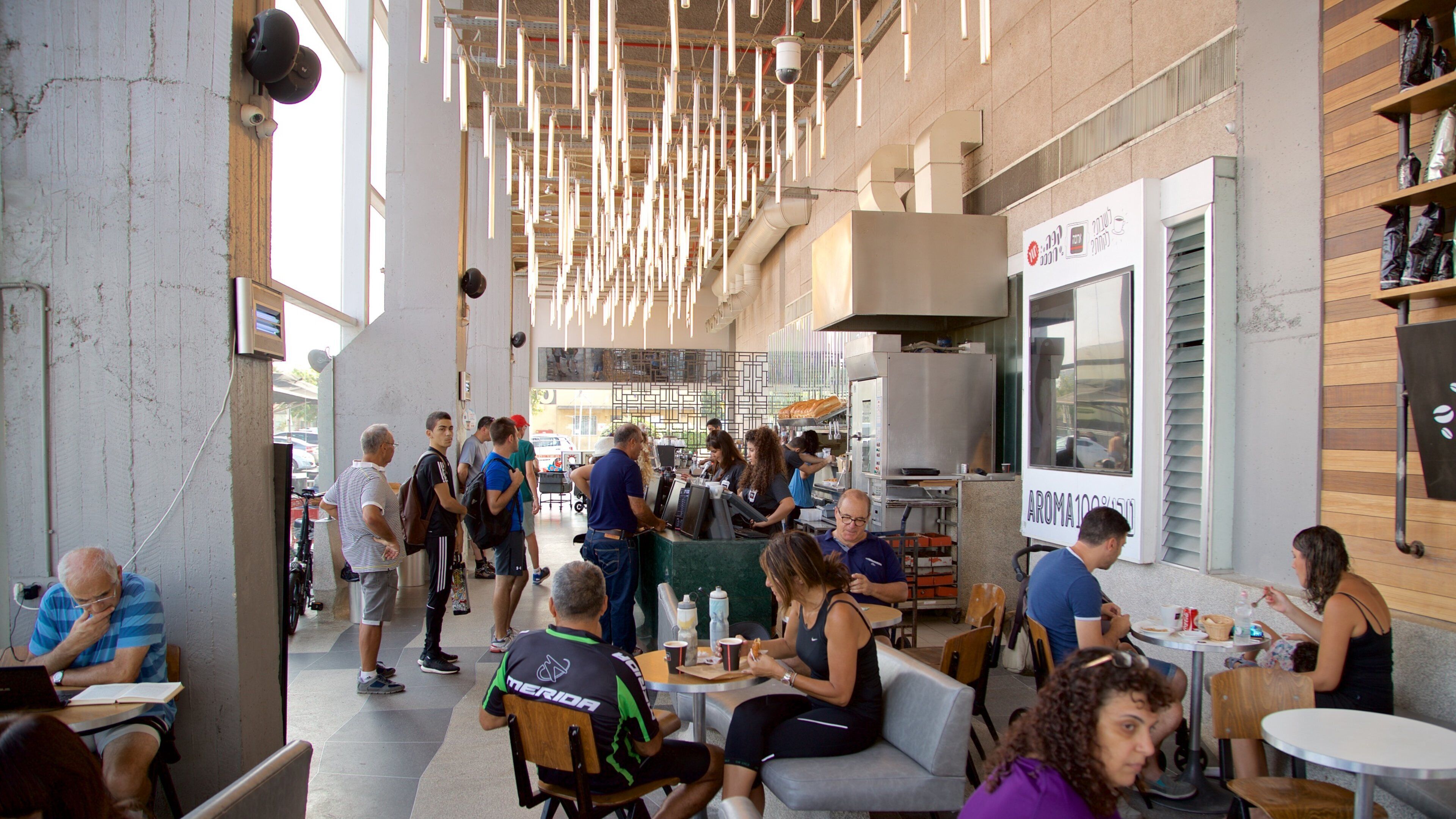 Old Tel Aviv Port showing cafe lifestyle and interior views as well as a small group of people