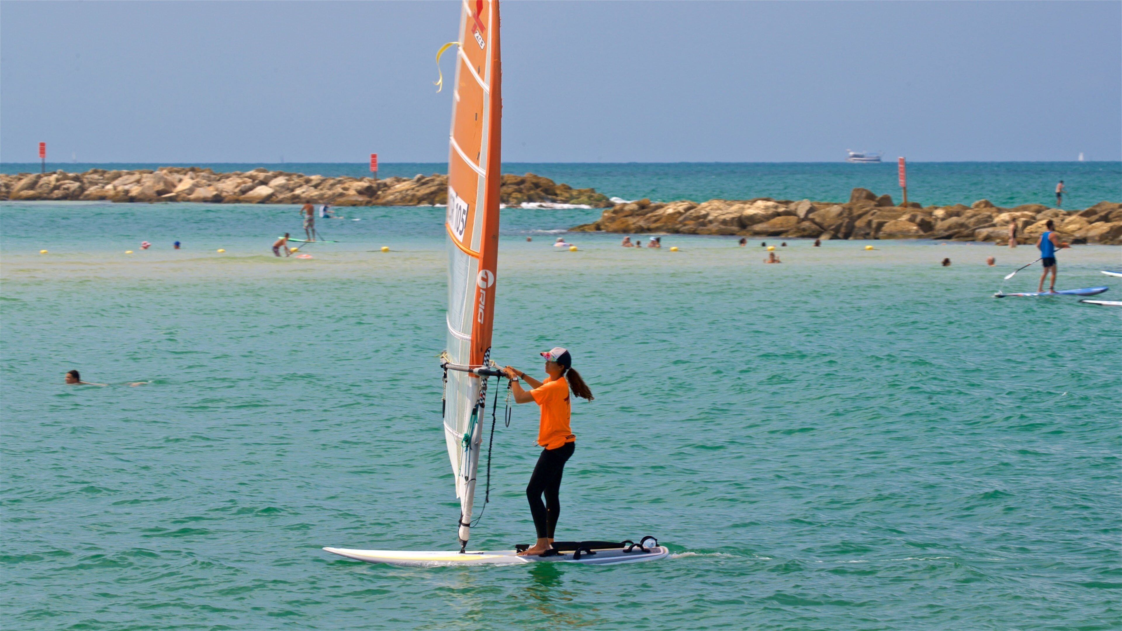 Gordon Beach featuring kayaking or canoeing and general coastal views as well as an individual femail