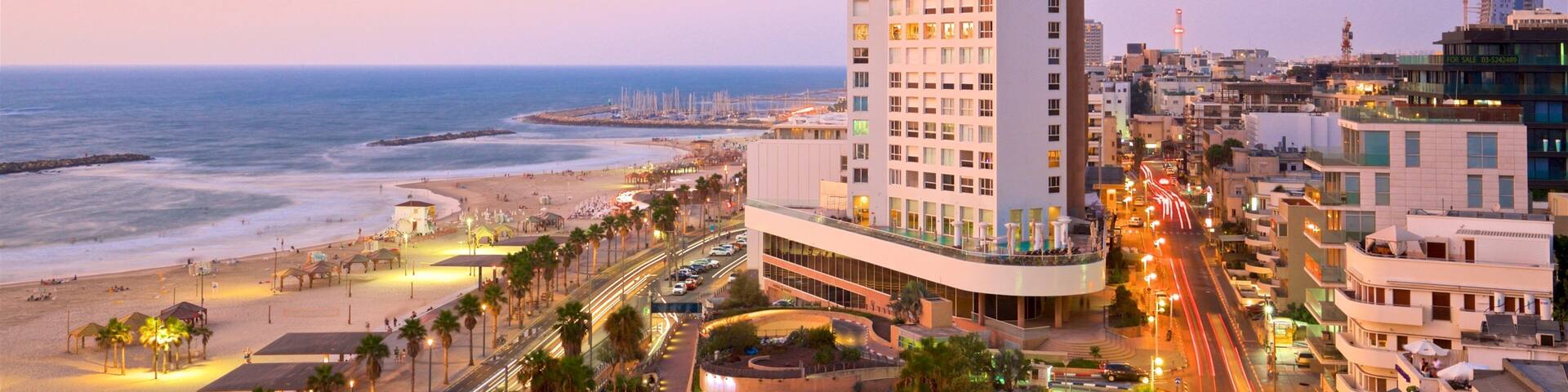 Plage Frishman montrant plage, vues littorales et coucher de soleil