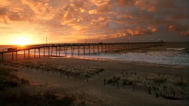 Pier on beach at sunrise, Oak Island, North Carolina