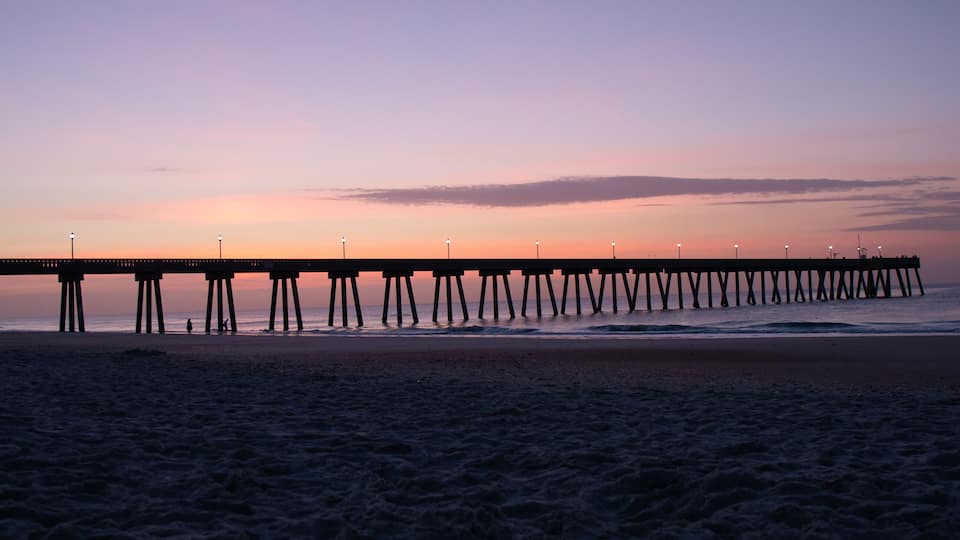 Silhoutted Ocean Pier at Sunrise