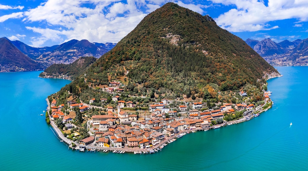 Italian lakes scenery. Magic Iseo lake .Aerial drone view of beautiful Monte Isola island and Peschiera Maraglio village. Italy, Brescia province