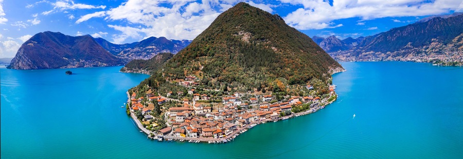 Italian lakes scenery. Magic Iseo lake .Aerial drone view of beautiful Monte Isola island and Peschiera Maraglio village. Italy, Brescia province