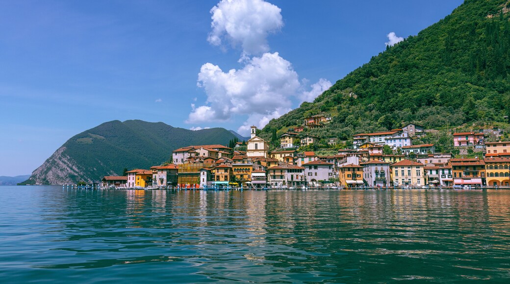 View from Lake Iseo to a small town on the island of Monte Isola Sulzano