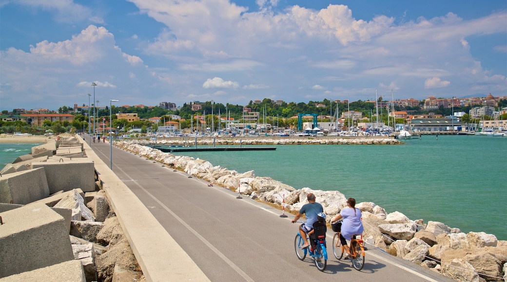 Giulianova Harbor featuring a bay or harbor and cycling as well as a couple