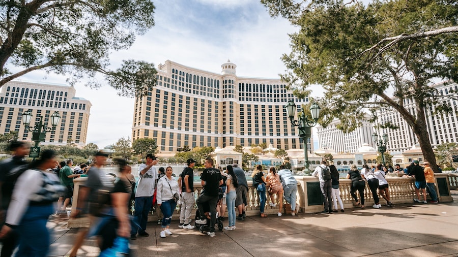 Bellagio Casino featuring street scenes and a hotel as well as a large group of people