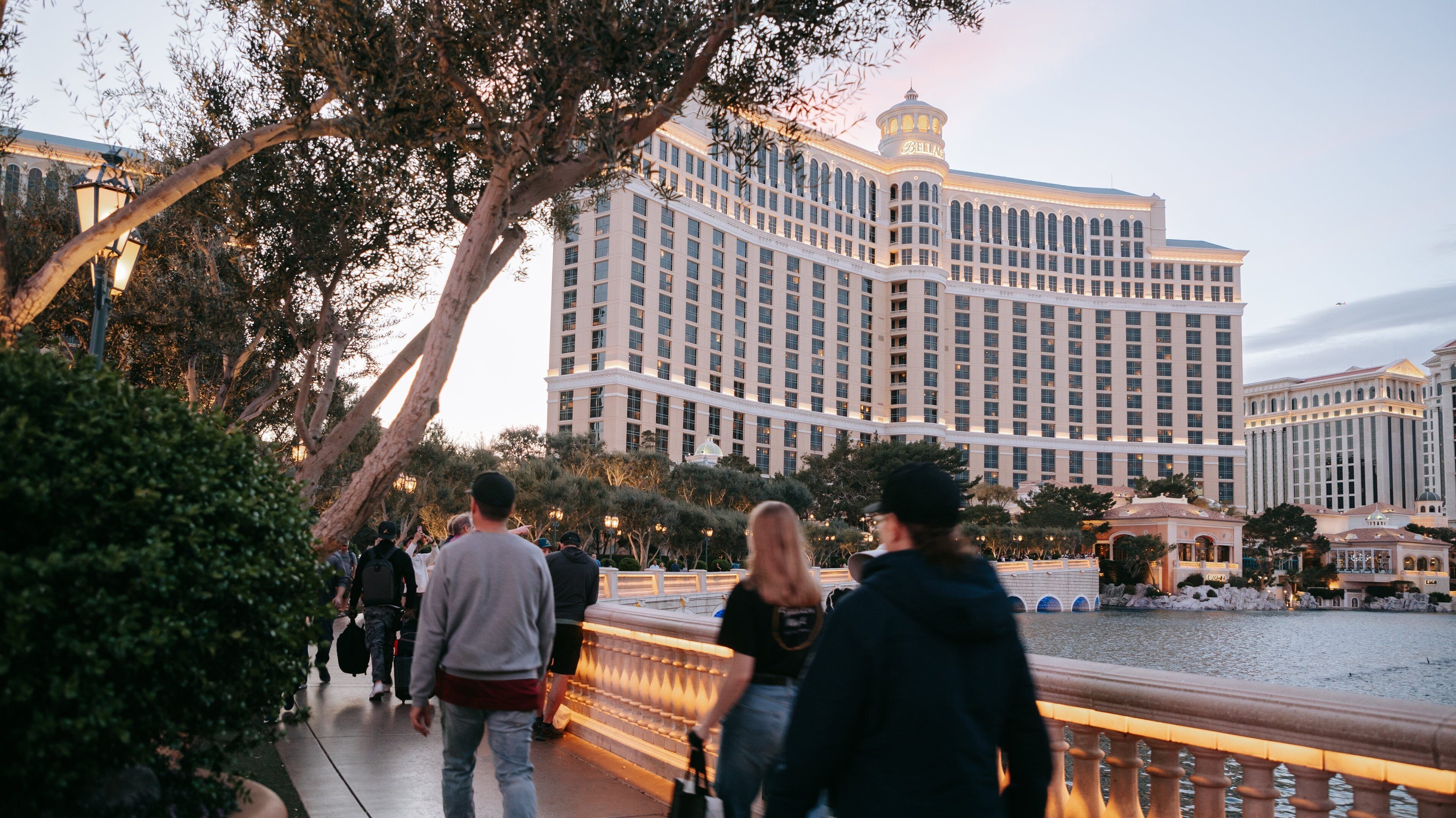 Bellagio Casino featuring a hotel, street scenes and a pond
