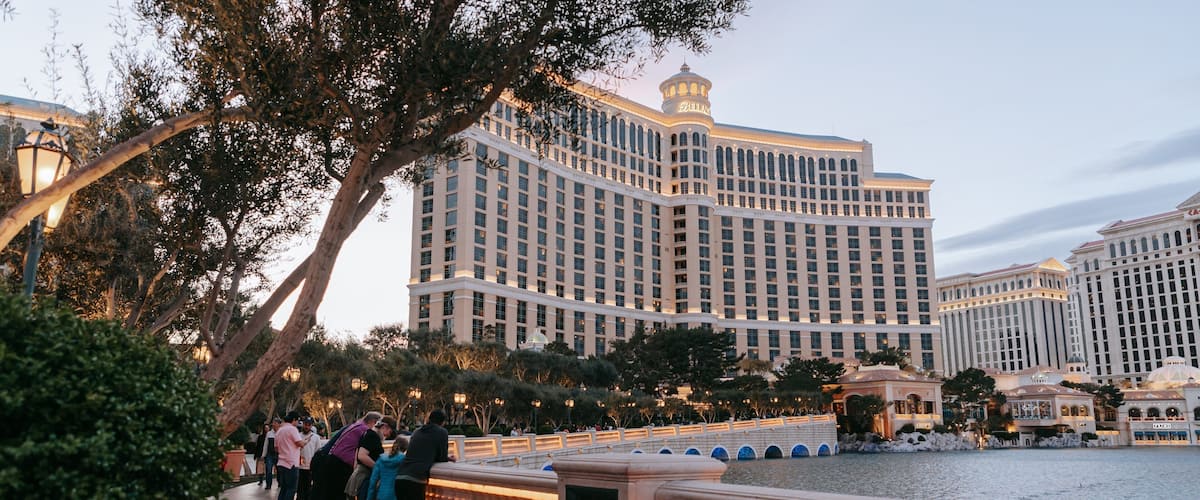 Bellagio Casino featuring a pond, a hotel and street scenes