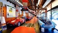 A vintage car museum with classic cars on display.