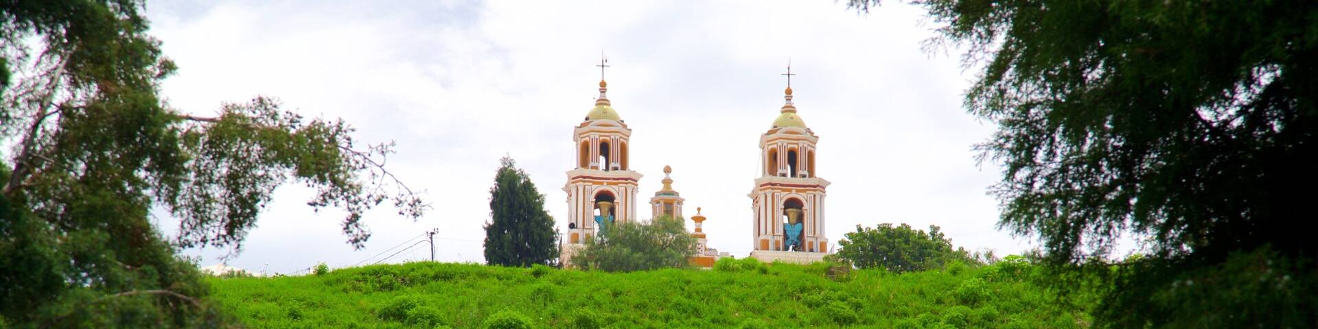 Great Pyramid of Cholula showing a church or cathedral and tranquil scenes as well as an individual male
