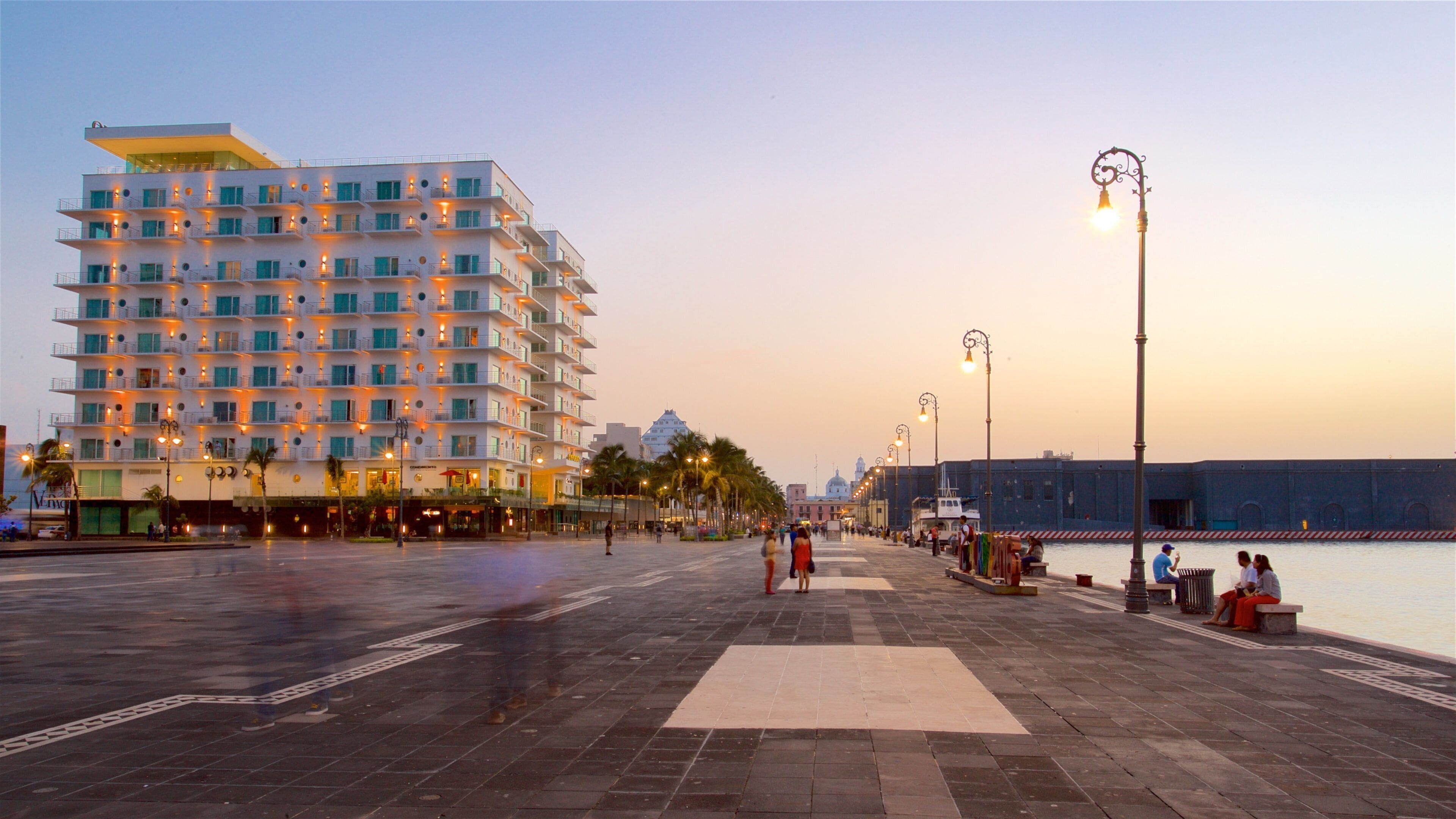 Veracruz Harbour which includes a square or plaza, a sunset and a bay or harbor