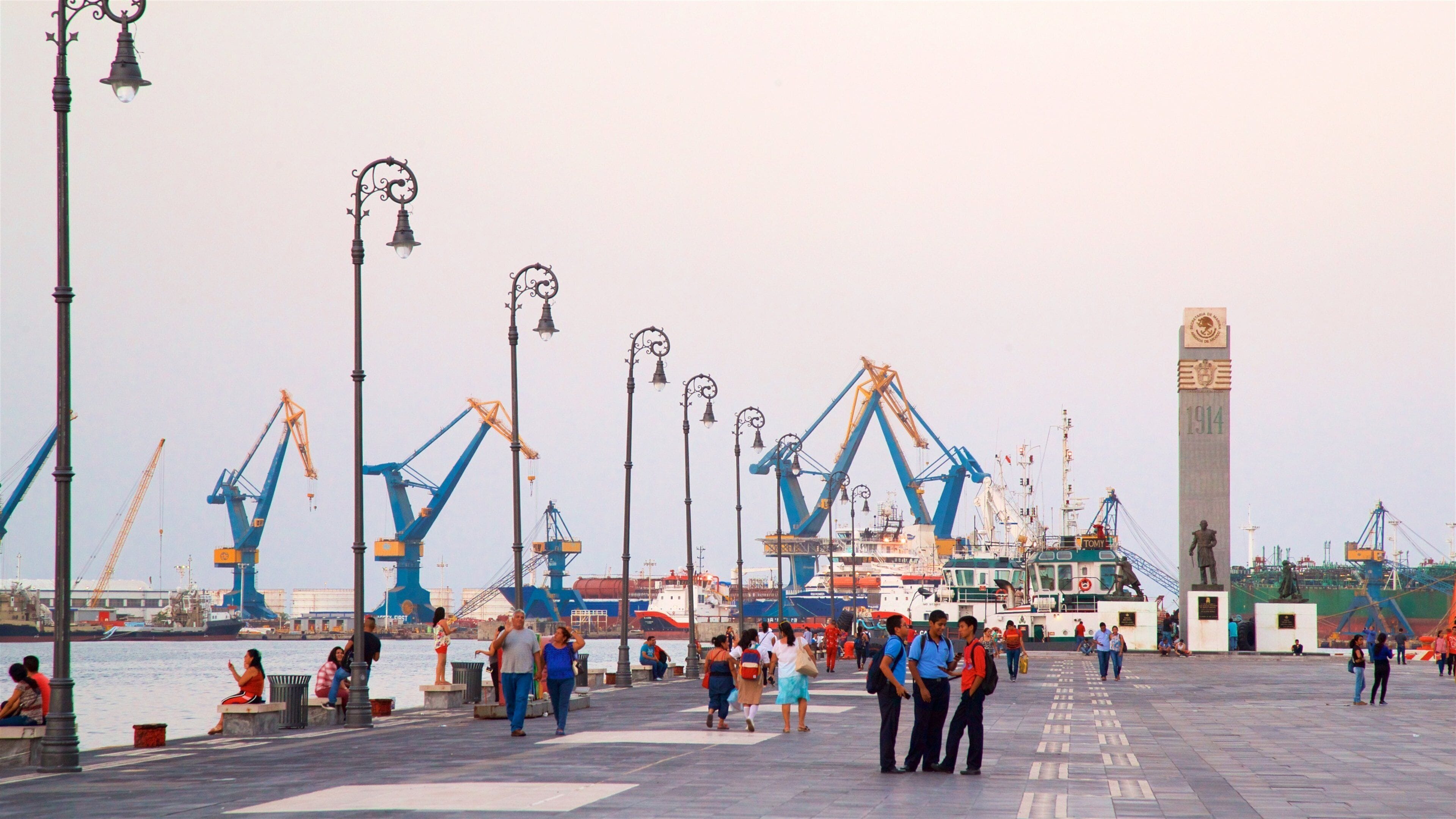 Veracruz Harbour featuring a bay or harbour and a square or plaza as well as a small group of people