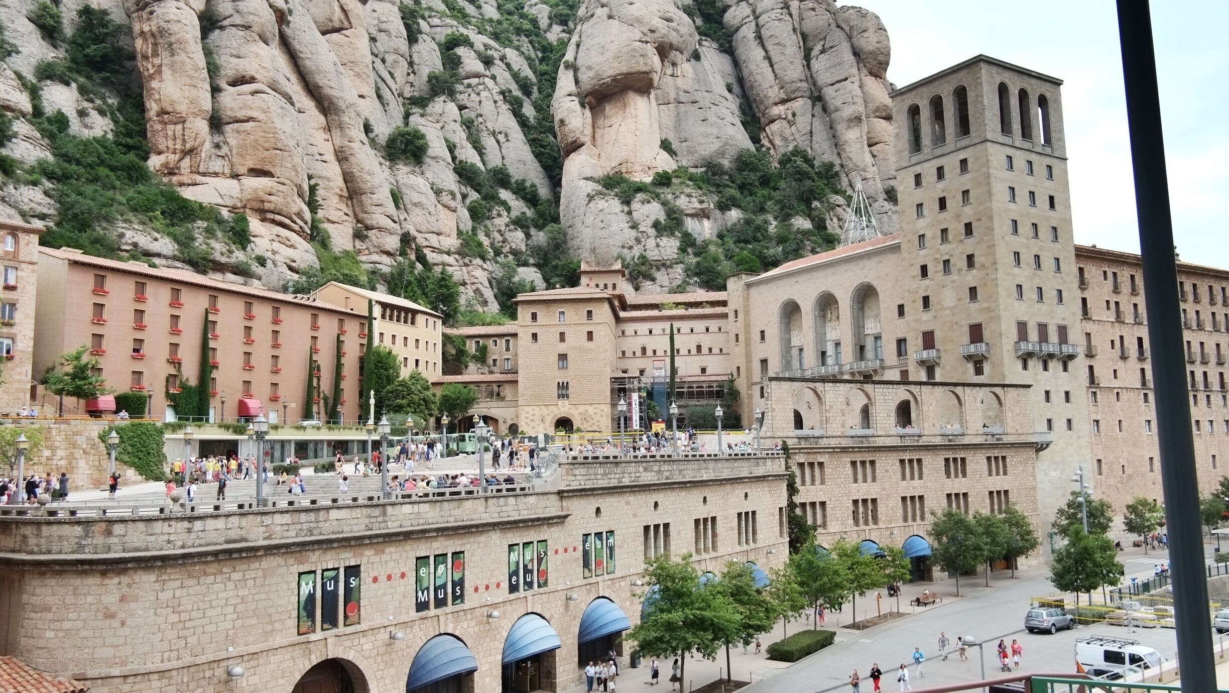 Santa Maria de Montserrat is a Benedictine abbey located on the mountain of Montserrat, in Monistrol de Montserrat, in Catalonia, Spain. It is notable for enshrining the image of the Virgin of Montserrat. The monastery was founded in the 10th century and still functions to this day, with over 70 monks.  The monastery has its historical origins in the hermitage of Santa Maria, which Count Guifré el Pelós gave to the Monastery of Ripoll in the year 888. There have always been roughly 80 monks in residence.