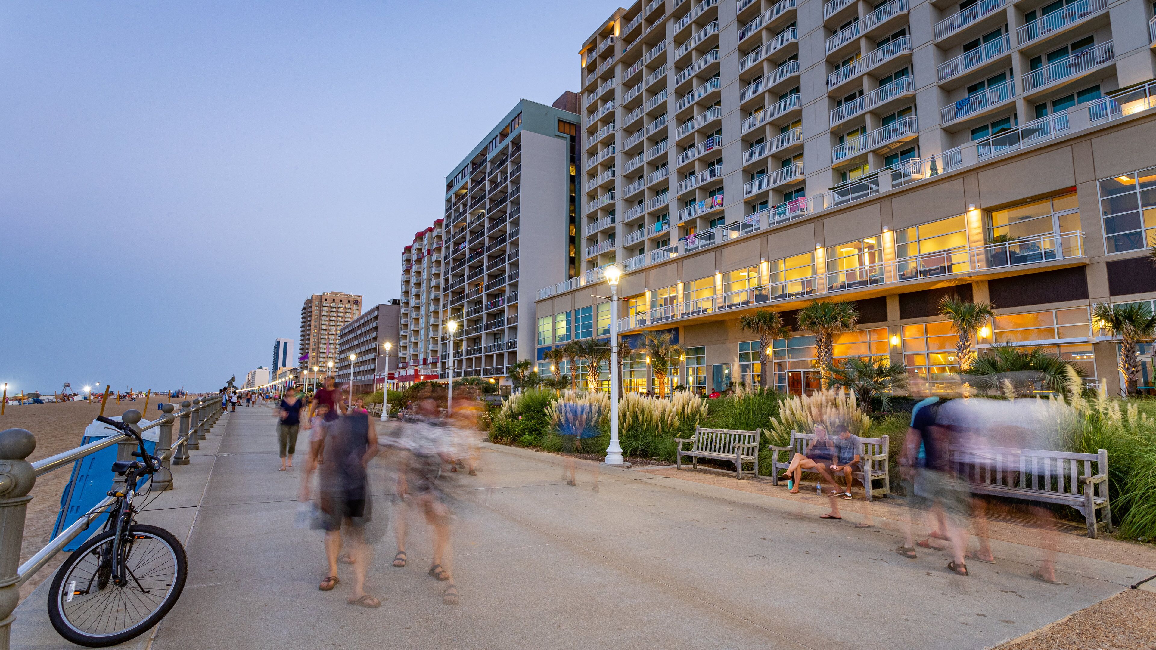 Virginia Beach Boardwalk featuring a sunset and a coastal town