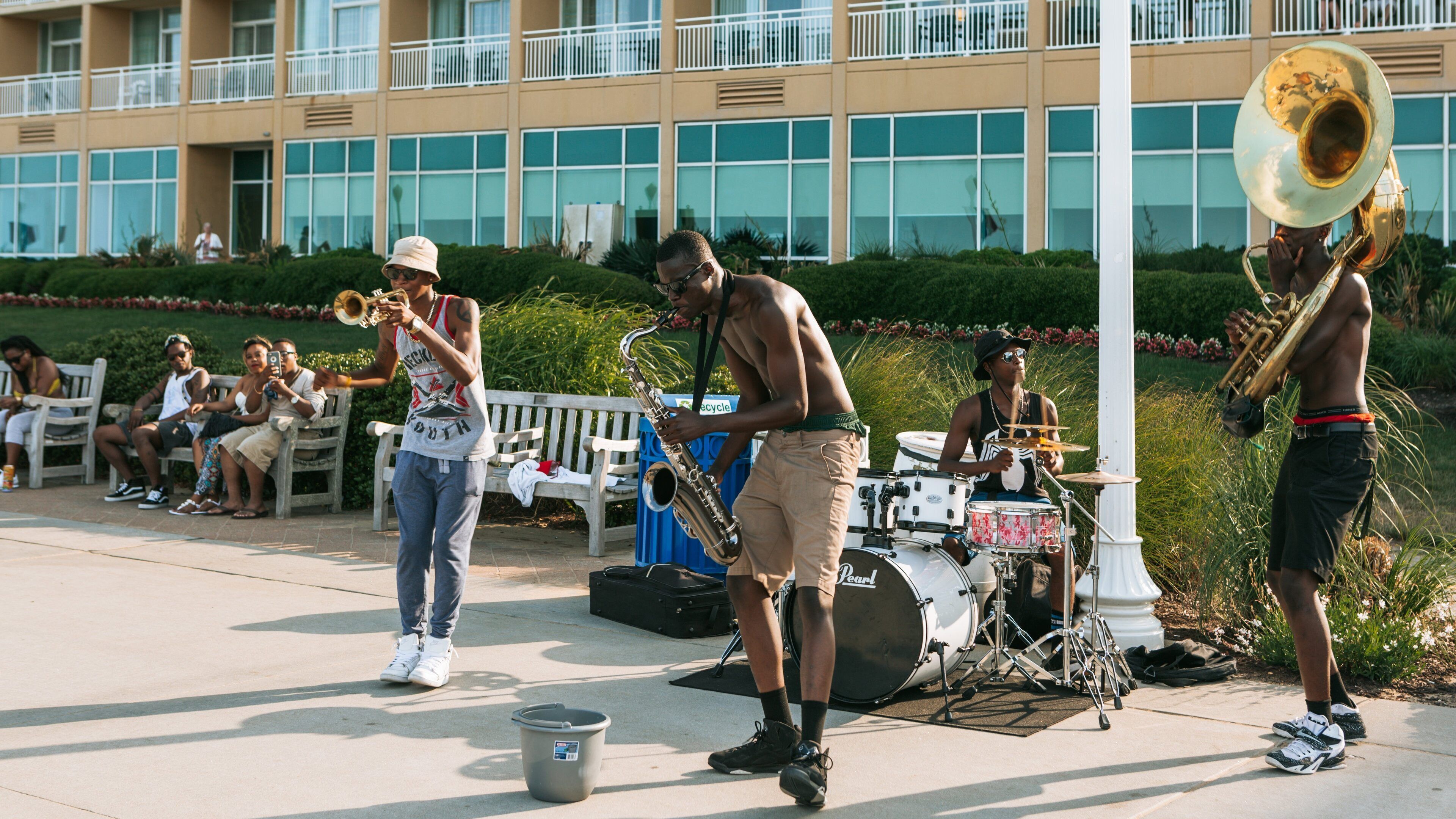 Virginia Beach Boardwalk showing street performance and music as well as a small group of people