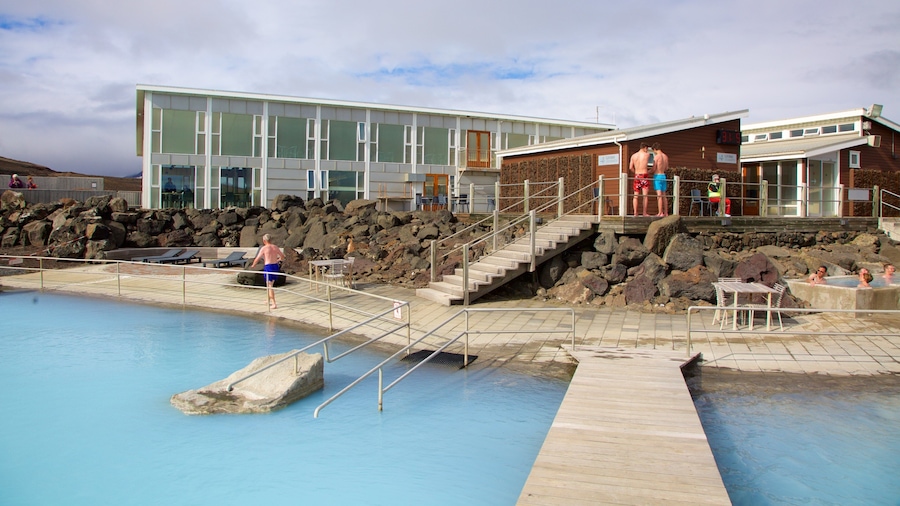 Myvatn Nature Baths which includes a luxury hotel or resort and a hot spring as well as a small group of people