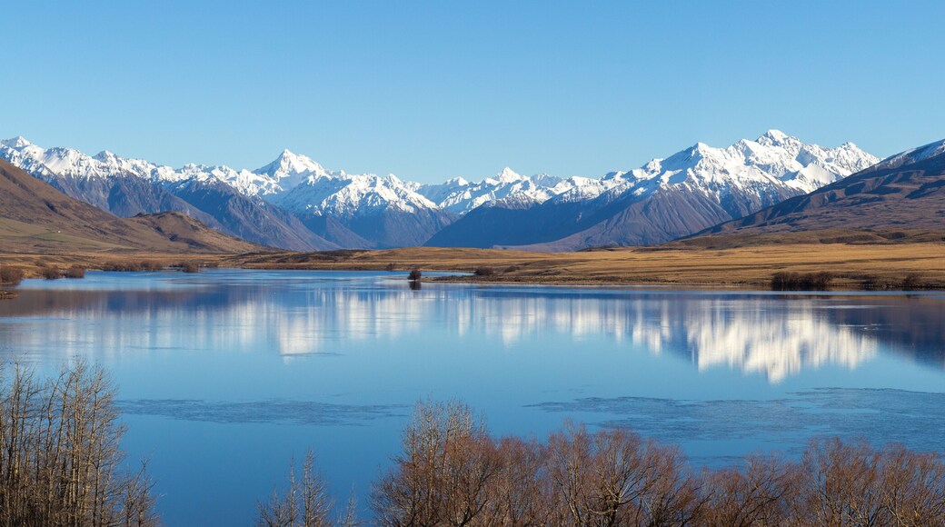 Lake Clearwater surrounded by snow capped mountain peaks of Southern Alps