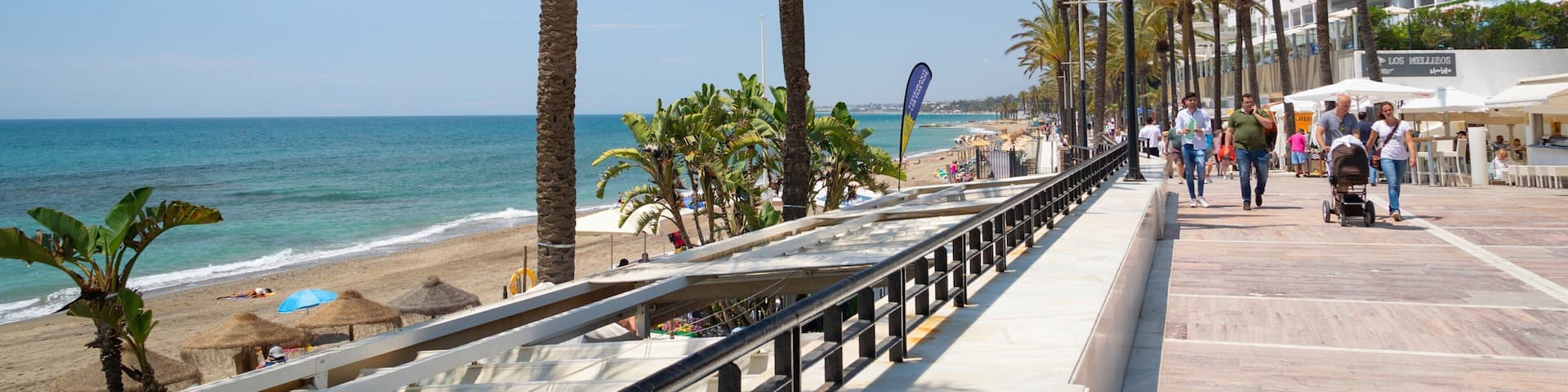 Marbella Seafront Promenade which includes general coastal views and a coastal town