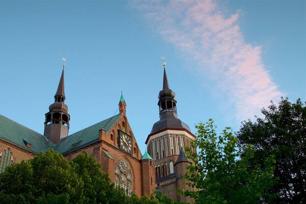 St. Mary\'s Church Stralsund featuring heritage architecture and a sunset