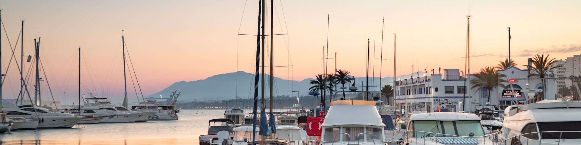 Marbella Marina showing a bay or harbor and a sunset