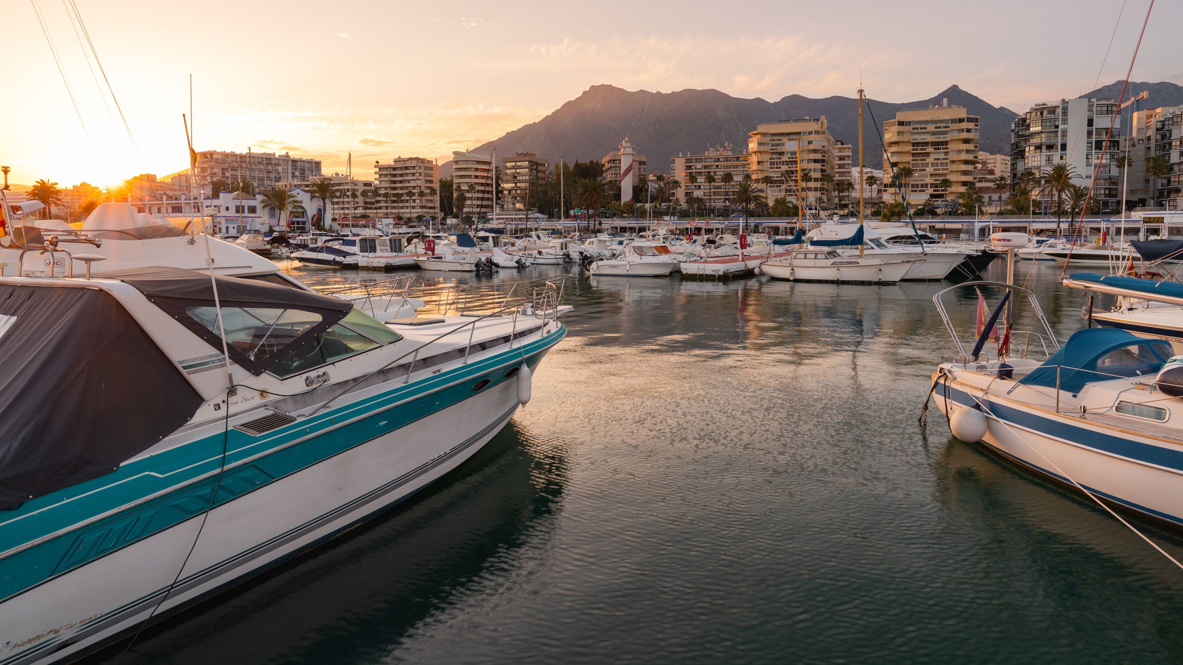 Marbella Marina showing a bay or harbor and a sunset