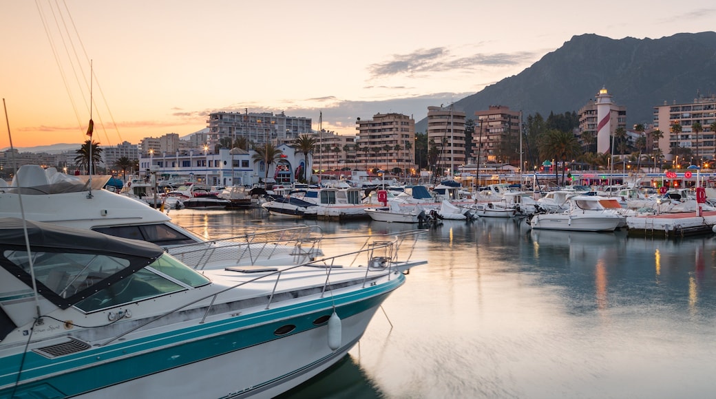 Marbella Marina which includes a bay or harbor and a sunset