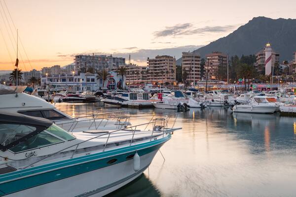 Marbella Marina which includes a bay or harbor and a sunset