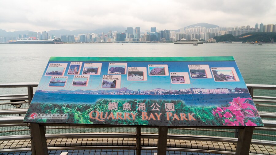 The Grand Promenade featuring signage and a bay or harbor