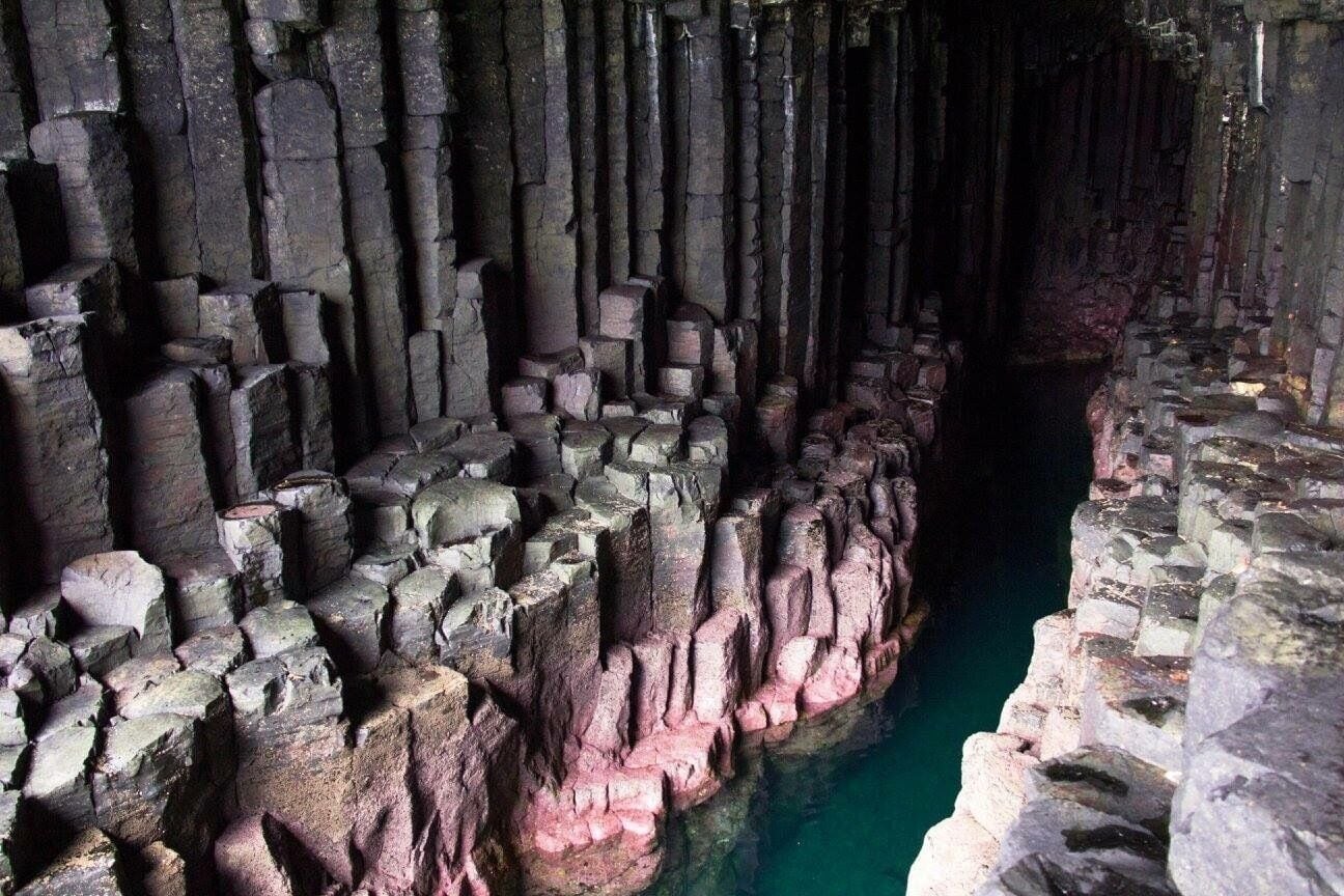A cave with stalactites and stalagmites.