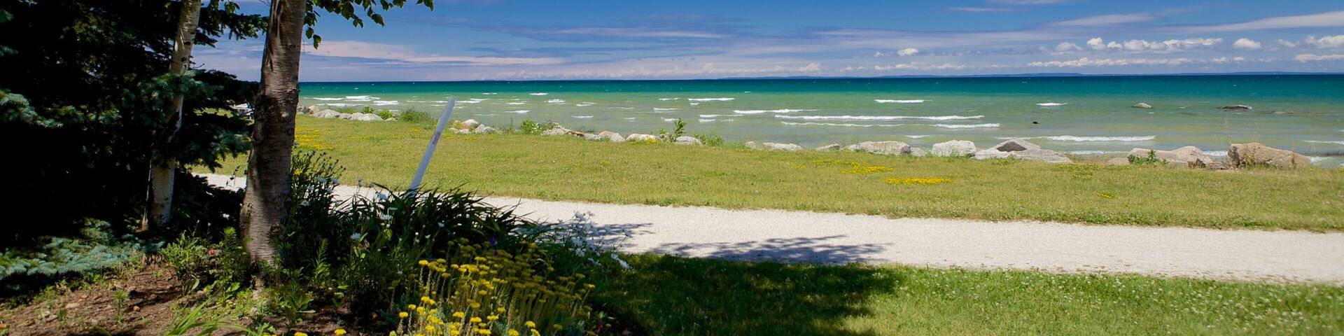 Sunset Point Park which includes a park and general coastal views