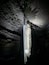 A cave with stalactites hanging from the ceiling.