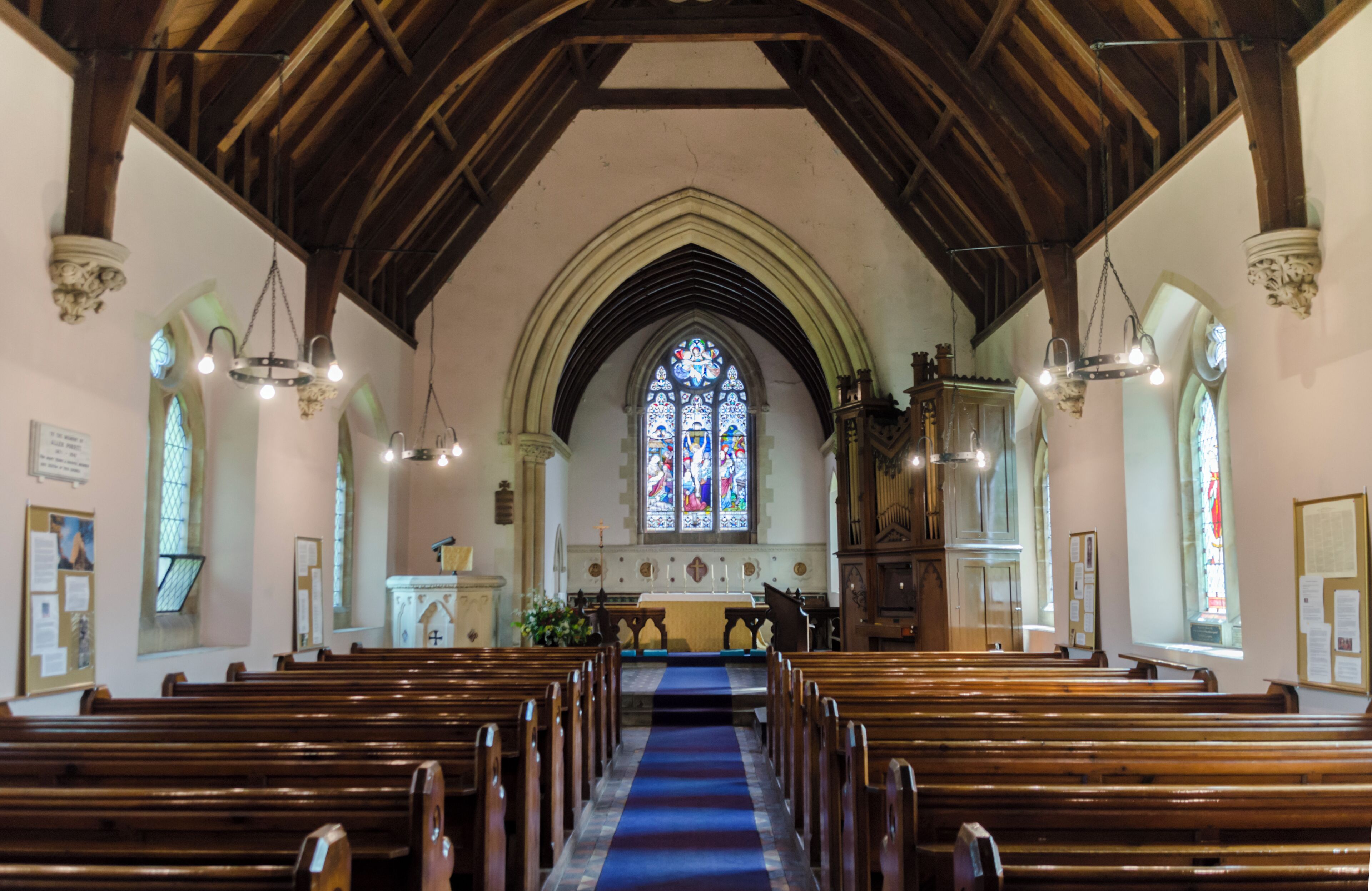 Early 14th C. church restored in 1866 by Atkinson. There was probably an earlier church. There is a western tower, nave with south porch, and chancel with vestry. The tower is of four stages dating from the early 14th century. It is built in ironstone and is quite weathered. The rest of the church is from the 19th century, replacing the church of 1766. The nave has no aisles, all the fittings date from the 19th century. There are two monuments which have survived from the 17th century.