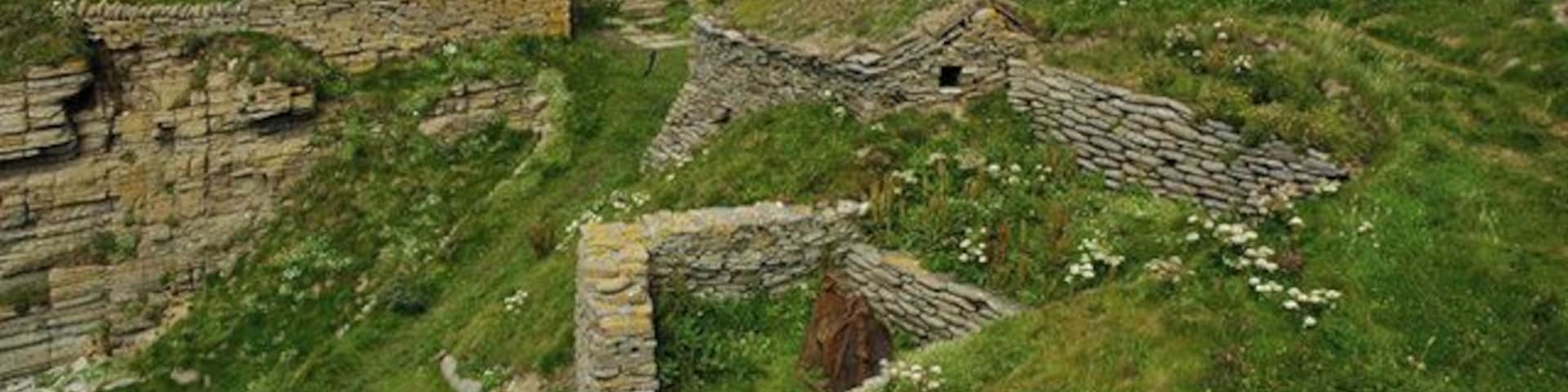 Fishermen's Huts at Sand Geo, Marwick The Marwick fishermen started using Sand Geo in 1896 after a tramp steamer beached at their usual landing place to the north. The three huts were built between 1898 and 1913. The winch used for hauling up the boats is said to come from the wreck of the steamer. The huts were restored in 1984 by the Scottish Conservation Projects Trust in association with the Orkney Islands Council.